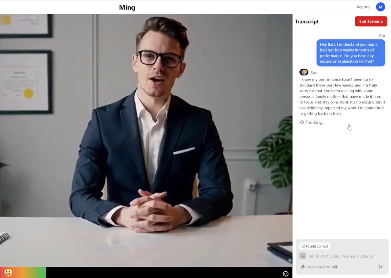 Ming’s role-play screen: the employee character, Bart, speaking on video at his desk, and the transcript beside him with the manager’s question about his last four weeks and his reply.