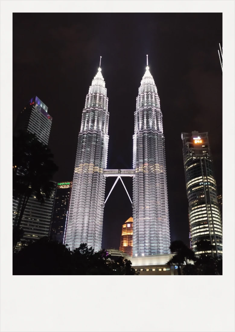 The Petronas Towers lit up at night.
